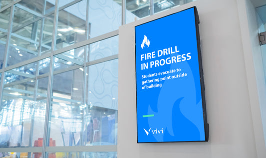 Display board in a school giving announcement about fire drill
